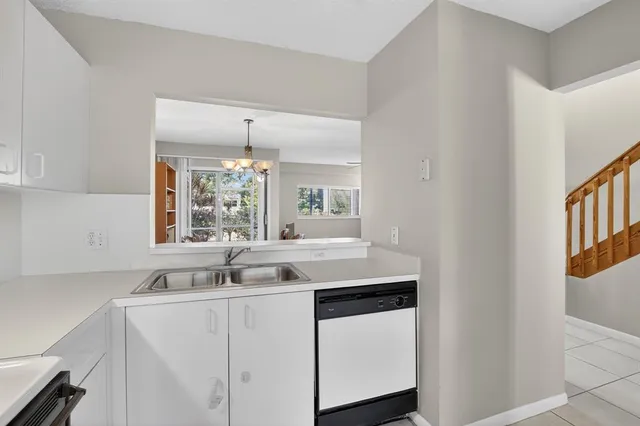 a kitchen with a sink a stove and refrigerator