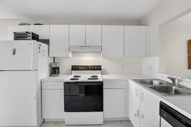 a view of a kitchen with washer and dryer