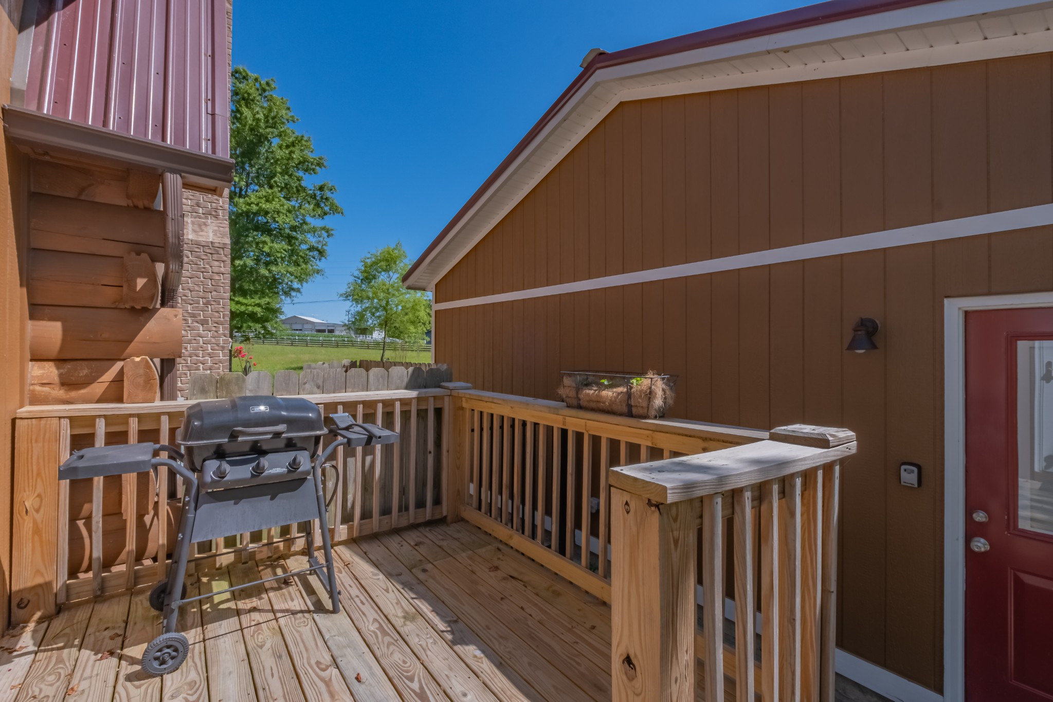 959 Ferrells Loop Road Manchester, TN 37355 - Photo 11 of 55 a view of balcony with wooden floor and outdoor seating