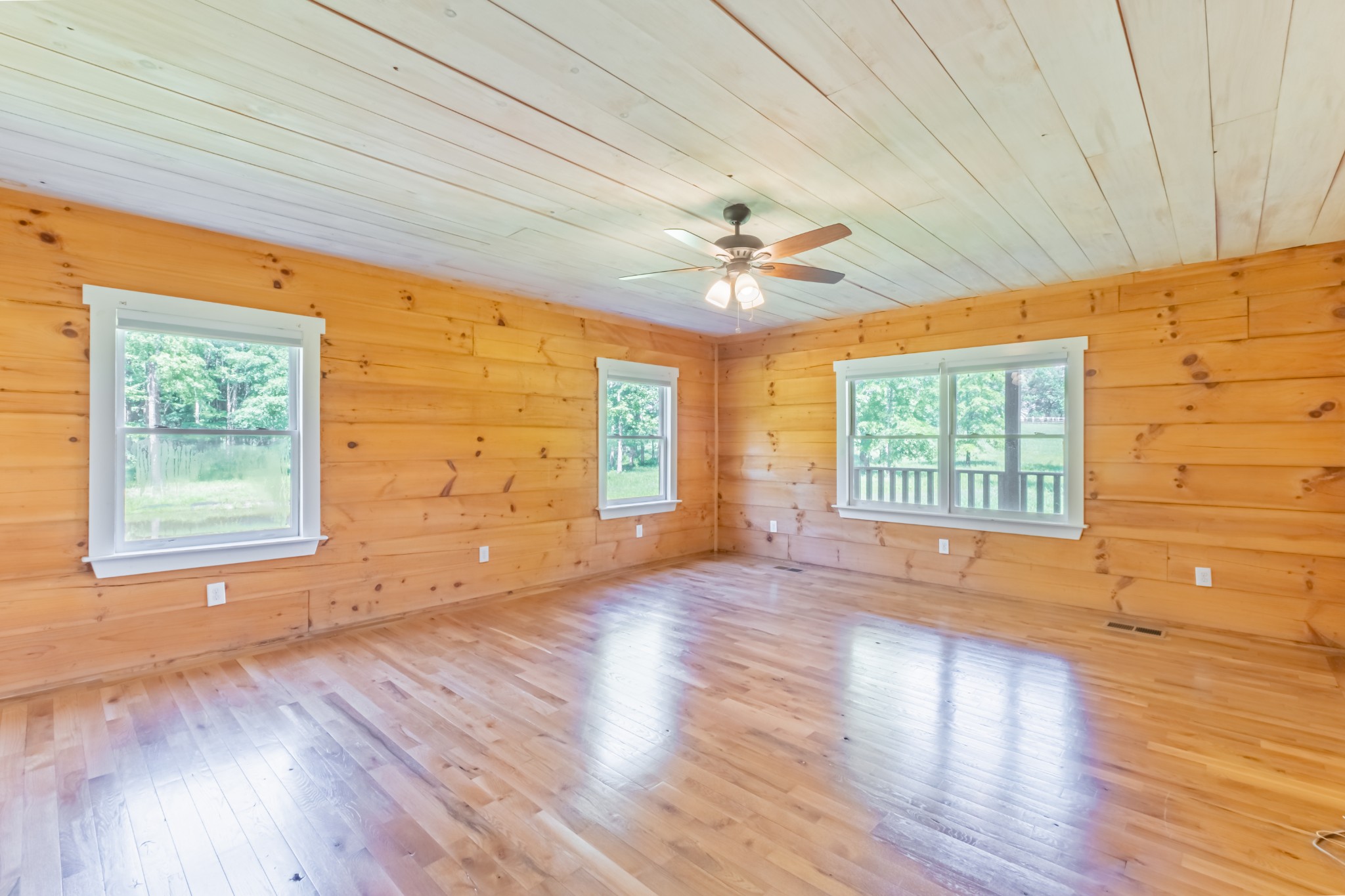959 Ferrells Loop Road Manchester, TN 37355 - Photo 26 of 55 an empty room with wooden floor and windows