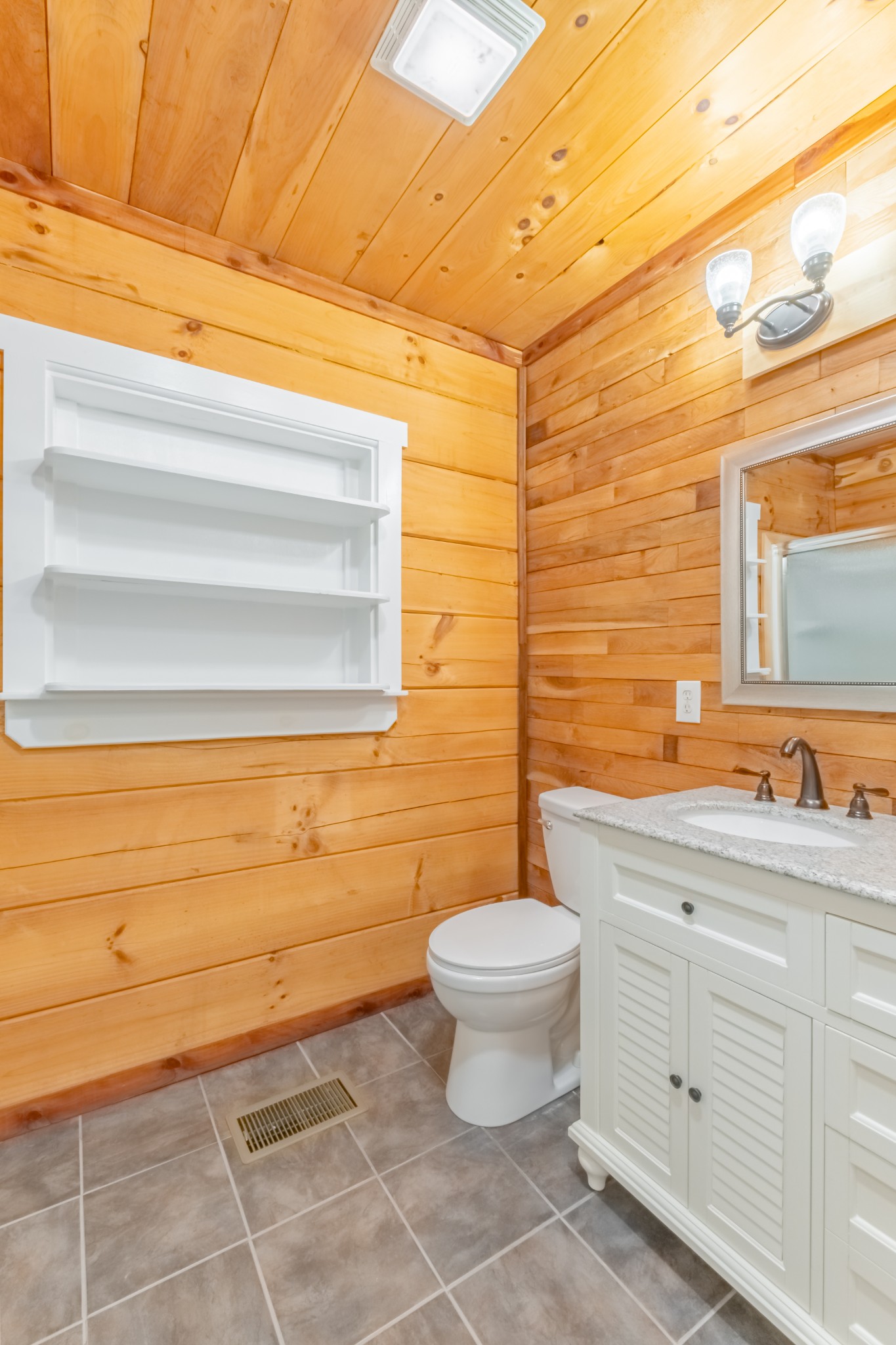 959 Ferrells Loop Road Manchester, TN 37355 - Photo 27 of 55 a bathroom with a toilet a sink and mirror