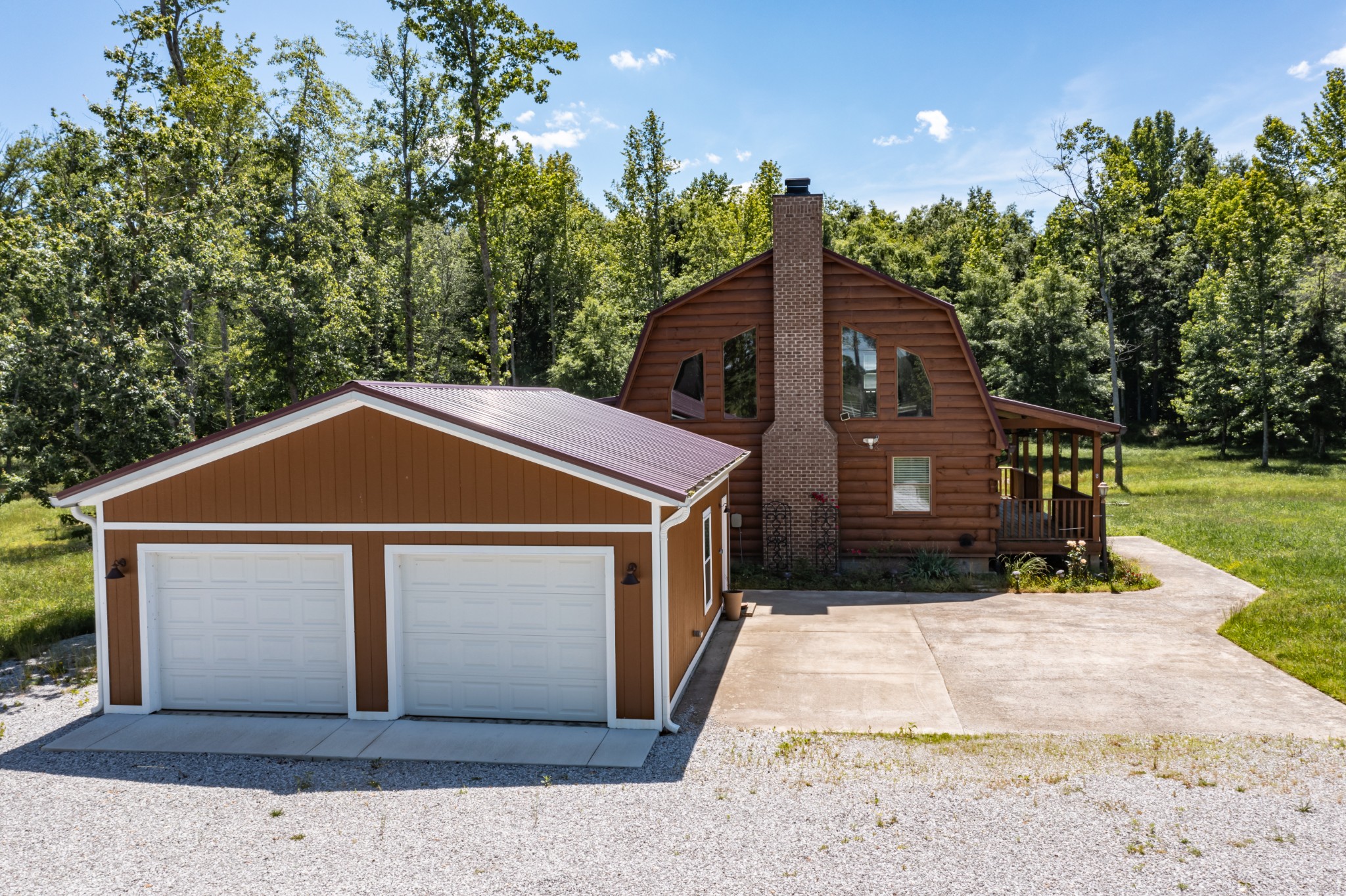 959 Ferrells Loop Road Manchester, TN 37355 - Photo 51 of 55 a front view of a house with a yard and garage