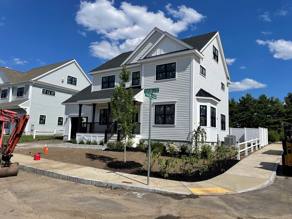 a front view of a house with garage