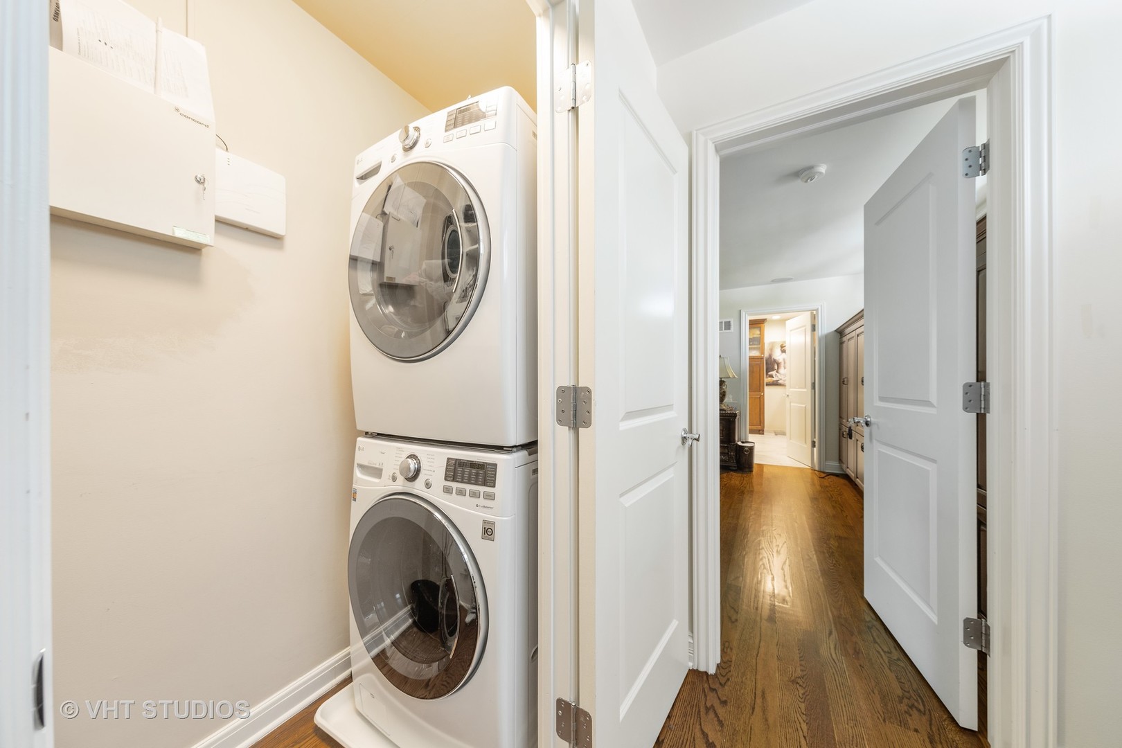 6547 South County Line Road Burr Ridge, IL 60527 - Photo 12 of 59 a view of a hallway with washer and dryer