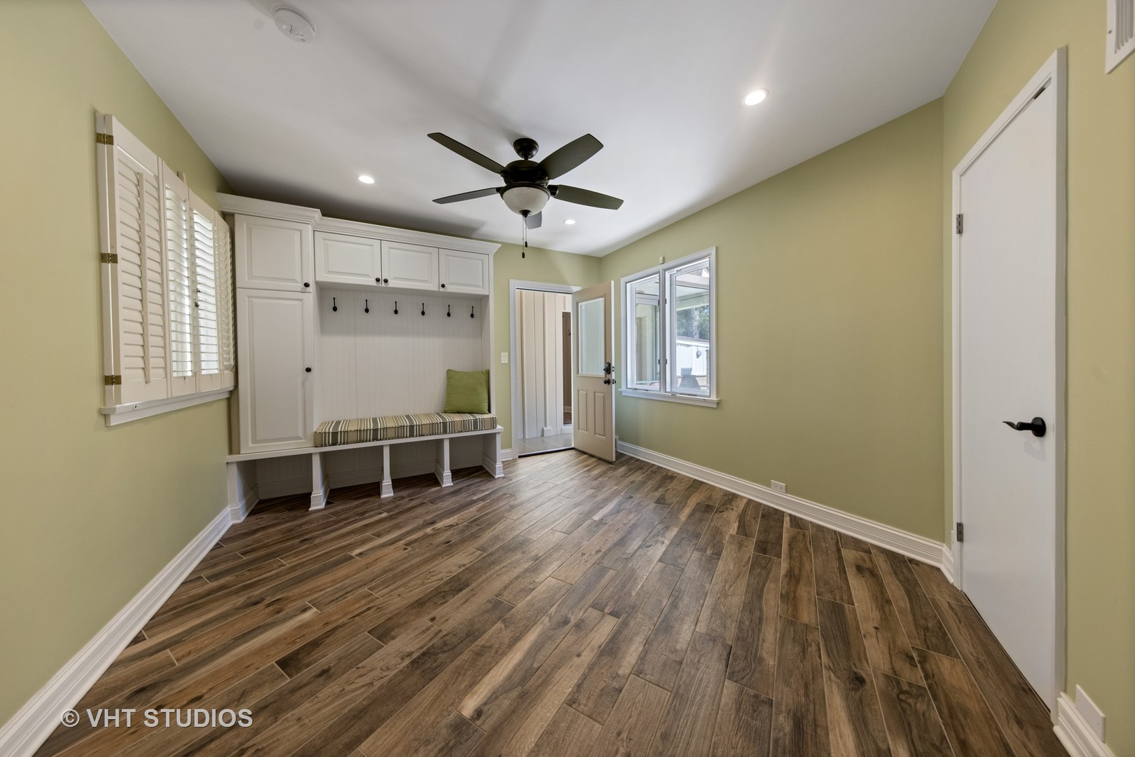 6547 South County Line Road Burr Ridge, IL 60527 - Photo 15 of 59 a view of an empty room with wooden floor and a window