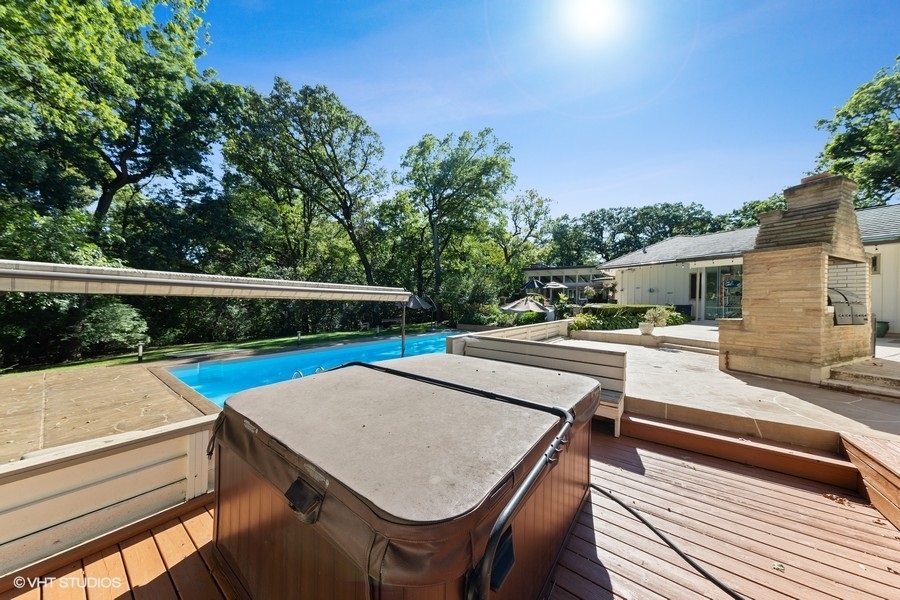 6547 South County Line Road Burr Ridge, IL 60527 - Photo 27 of 59 a view of a patio with table and chairs a barbeque with wooden floor and fence
