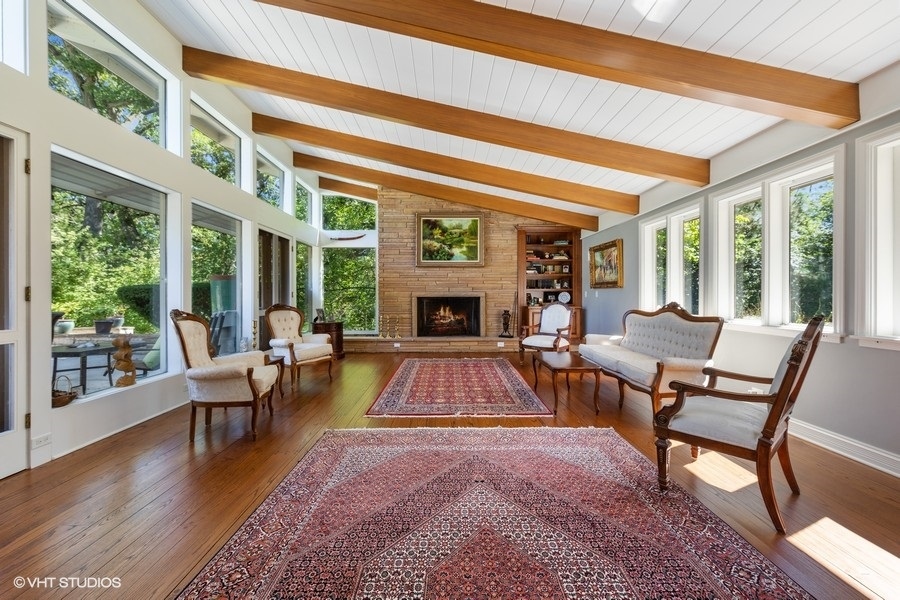 6547 South County Line Road Burr Ridge, IL 60527 - Photo 4 of 59 a living room with furniture fireplace and flat screen tv