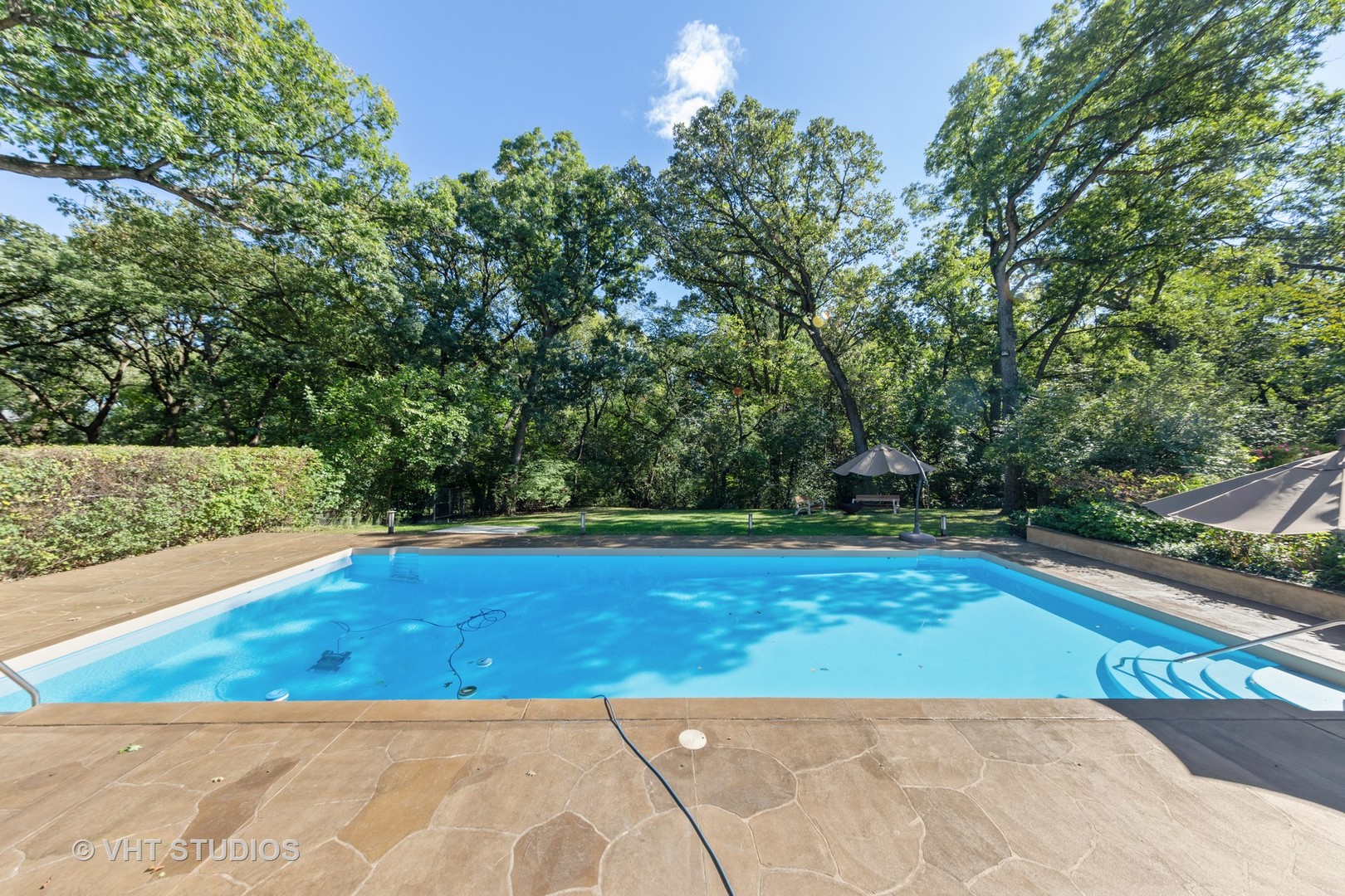 6547 South County Line Road Burr Ridge, IL 60527 - Photo 31 of 59 a view of a swimming pool with an outdoor space