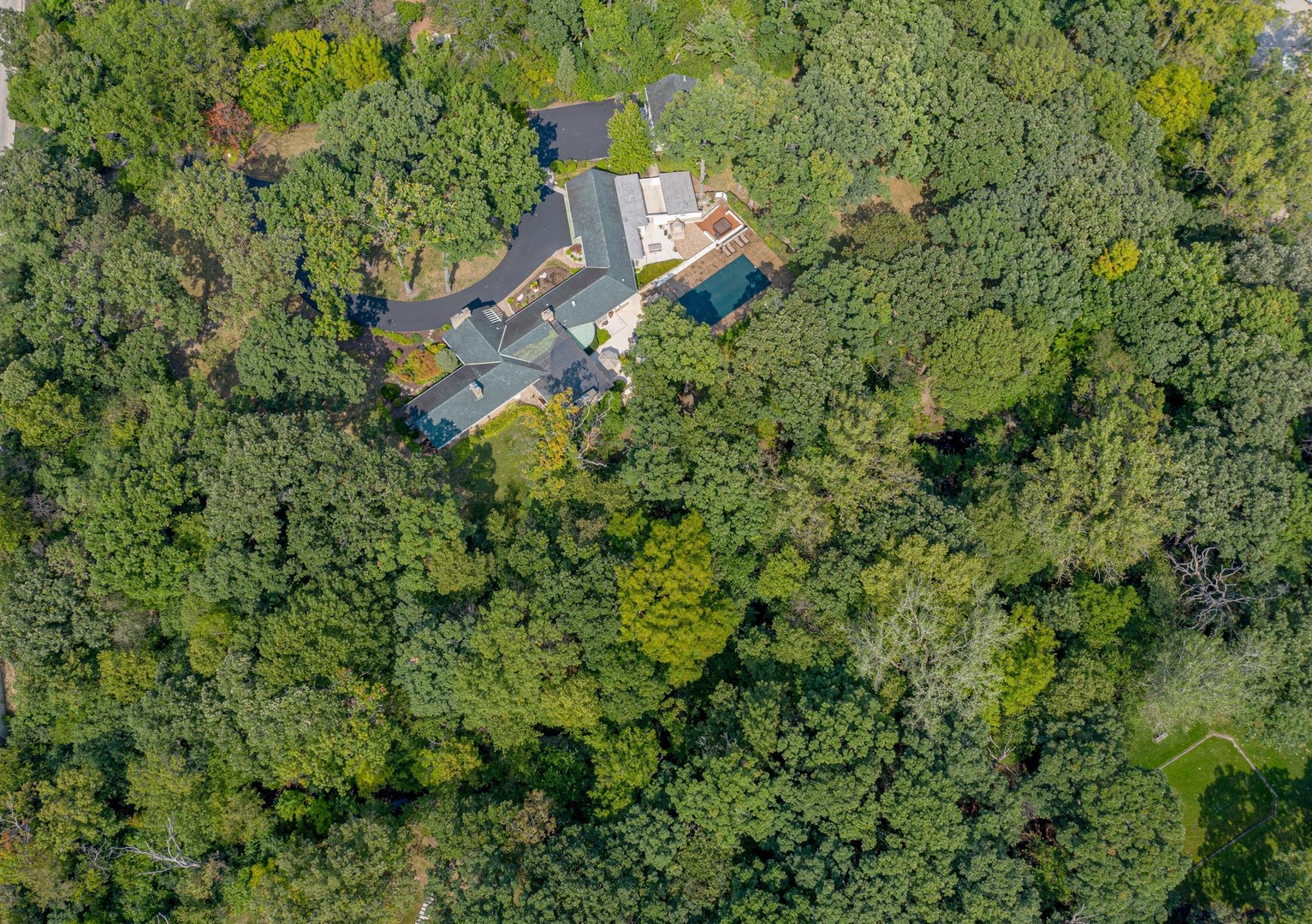 6547 South County Line Road Burr Ridge, IL 60527 - Photo 32 of 59 an aerial view of a house with a yard