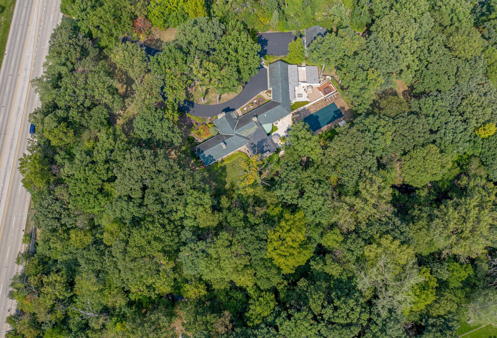 6547 South County Line Road Burr Ridge, IL 60527 - Photo 41 of 59 an aerial view of a house with a yard