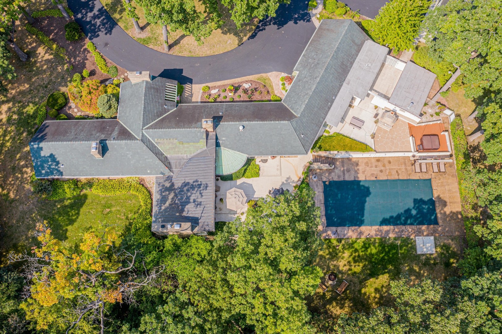 6547 South County Line Road Burr Ridge, IL 60527 - Photo 47 of 59 an aerial view of a house with a swimming pool and garden space