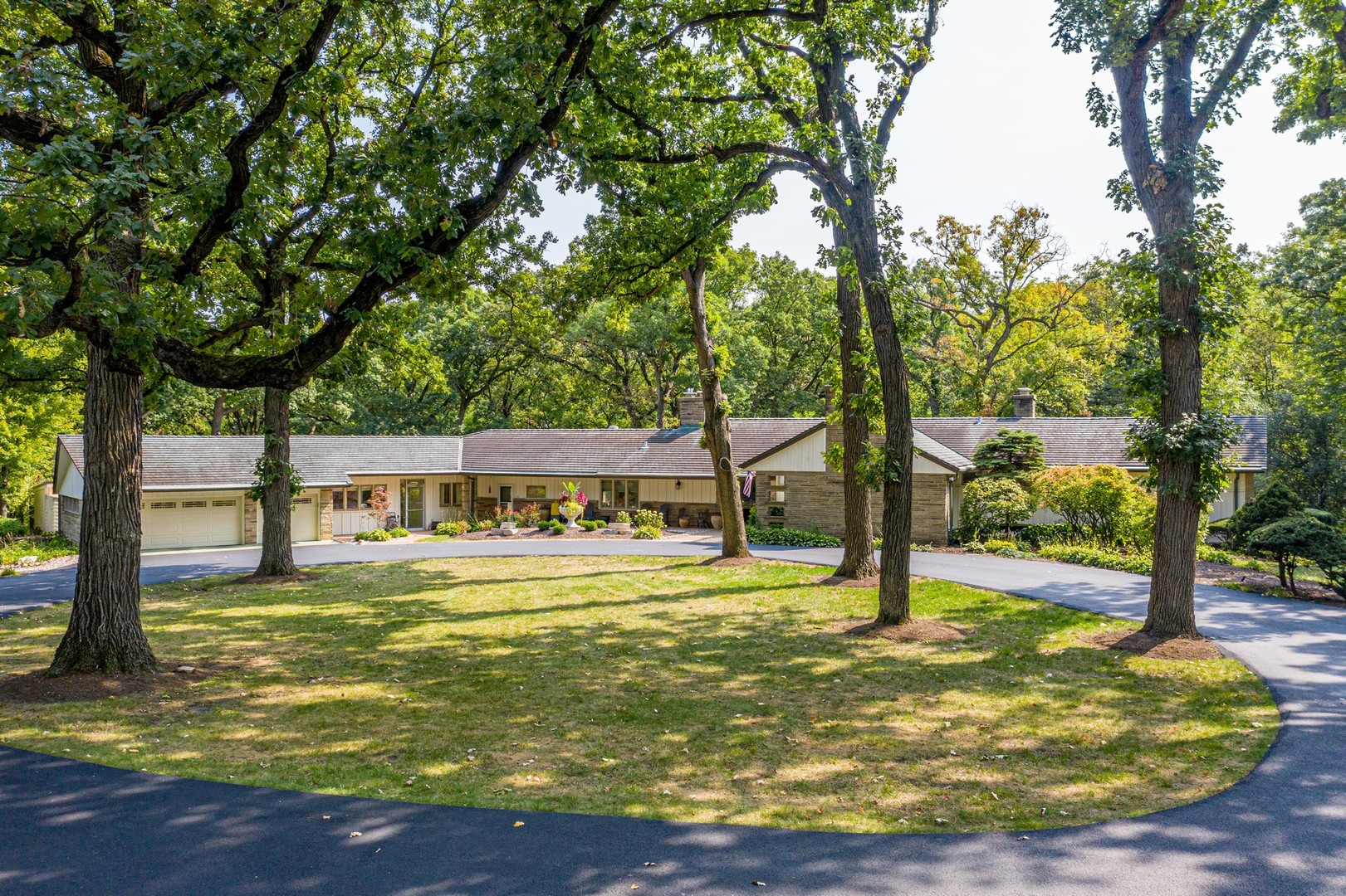 6547 South County Line Road Burr Ridge, IL 60527 - Photo 49 of 59 a view of a swimming pool with a patio