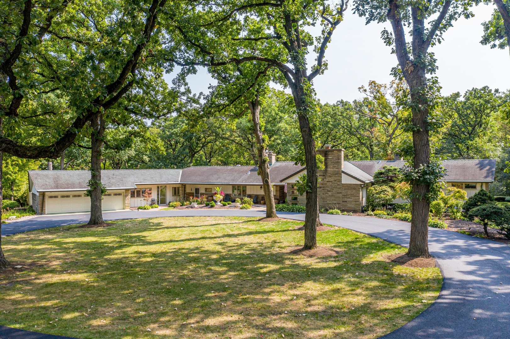 6547 South County Line Road Burr Ridge, IL 60527 - Photo 50 of 59 a swimming pool with outdoor seating and yard