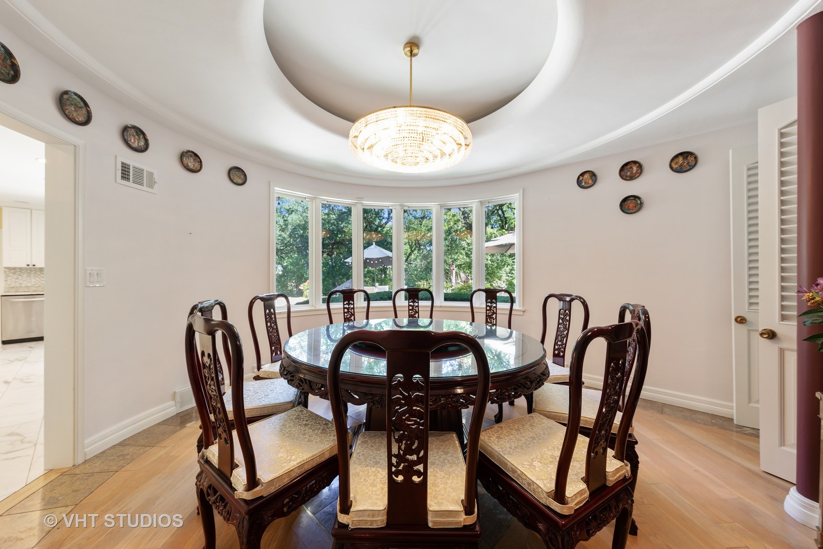 6547 South County Line Road Burr Ridge, IL 60527 - Photo 7 of 59 a view of a dining room with furniture and chandelier