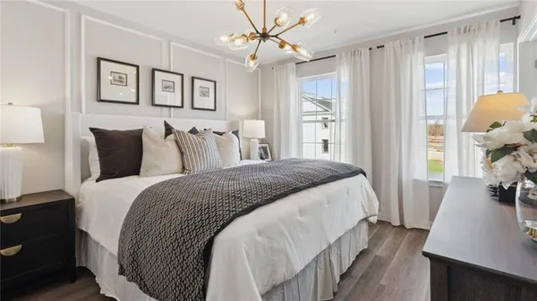 a bedroom with bed and a window