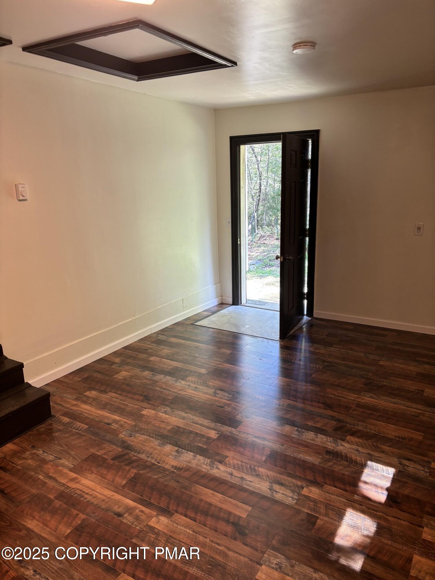 1360 Clover Road North Long Pond, PA 18334 - Photo 20 of 30 a view of an empty room with wooden floor and a window