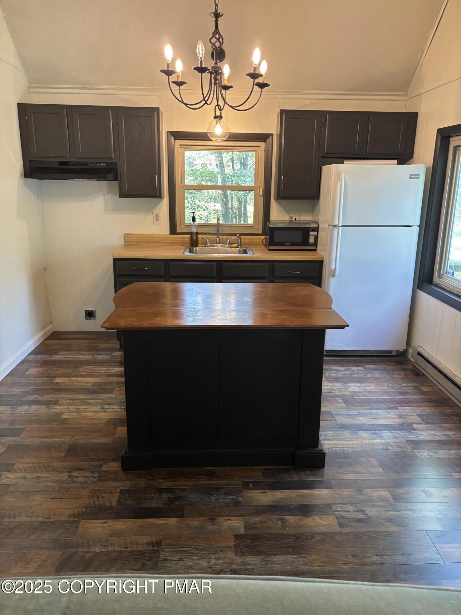 1360 Clover Road North Long Pond, PA 18334 - Photo 24 of 30 a kitchen with kitchen island a counter top a sink a stove and refrigerator