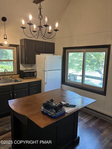 a kitchen with a stove and a refrigerator