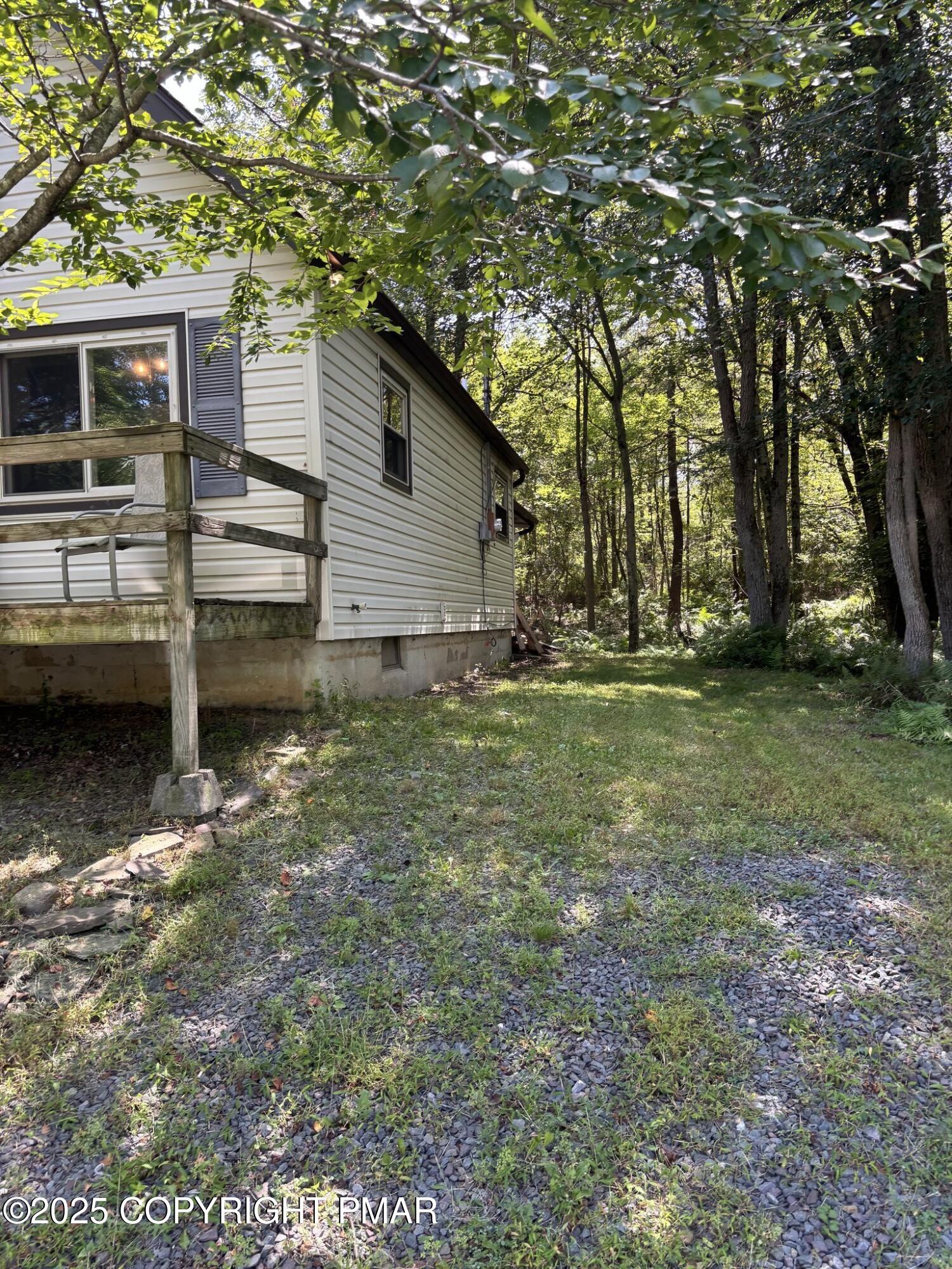 1360 Clover Road North Long Pond, PA 18334 - Photo 3 of 30 a backyard of a house with barbeque oven