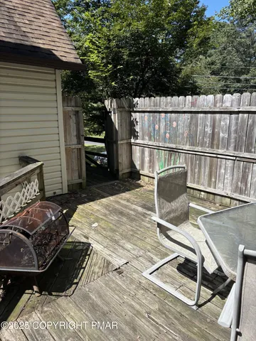 a view of a balcony with chairs