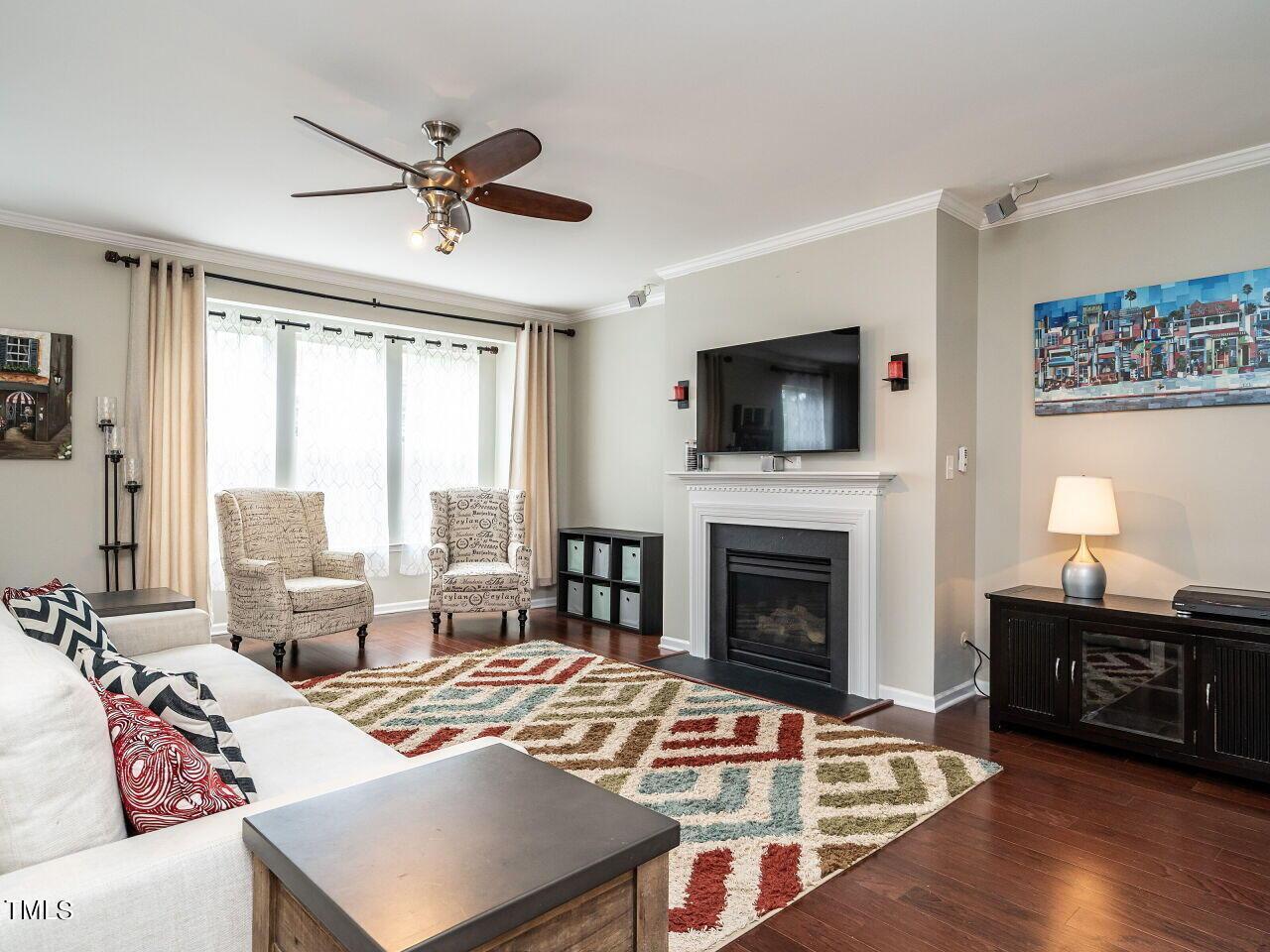 1316 Cornell Place Raleigh, NC 27607 - Photo 7 of 31 a living room with furniture fireplace and flat screen tv