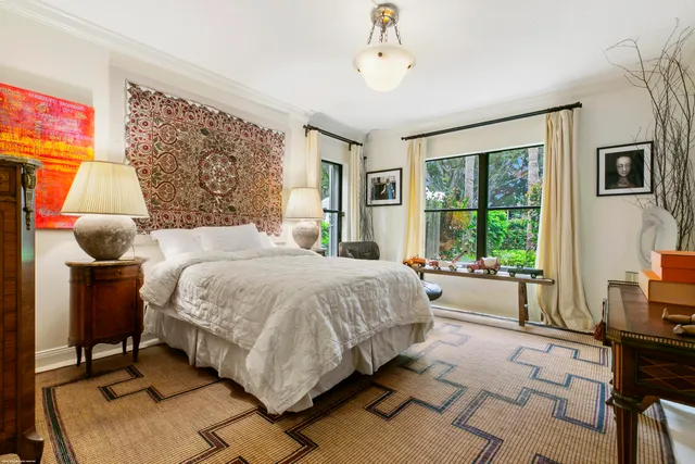 a spacious bedroom with a large bed and a window