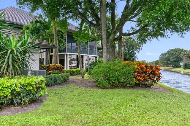 a view of a yard with a lake view