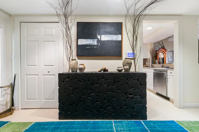 a view of living room with a flat screen tv and a couch