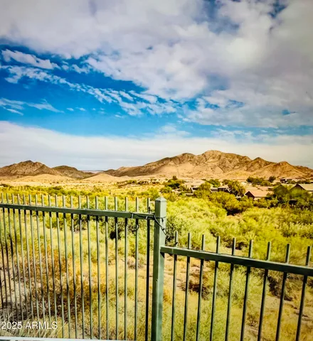 a view of a road with a tree in the background