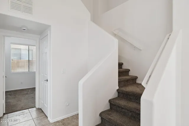 a kitchen with stainless steel appliances a refrigerator a sink a stove a microwave and cabinets