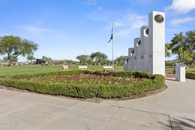 a view of a lake with boats and trees in the background