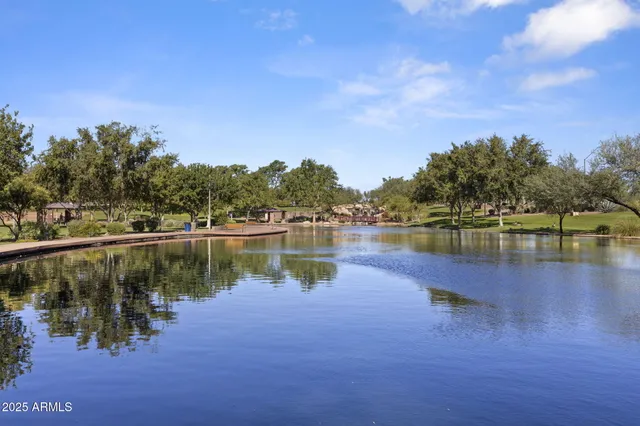 a view of a swimming pool and an outdoor seating