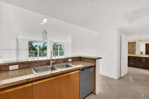 a kitchen that has a sink and a window