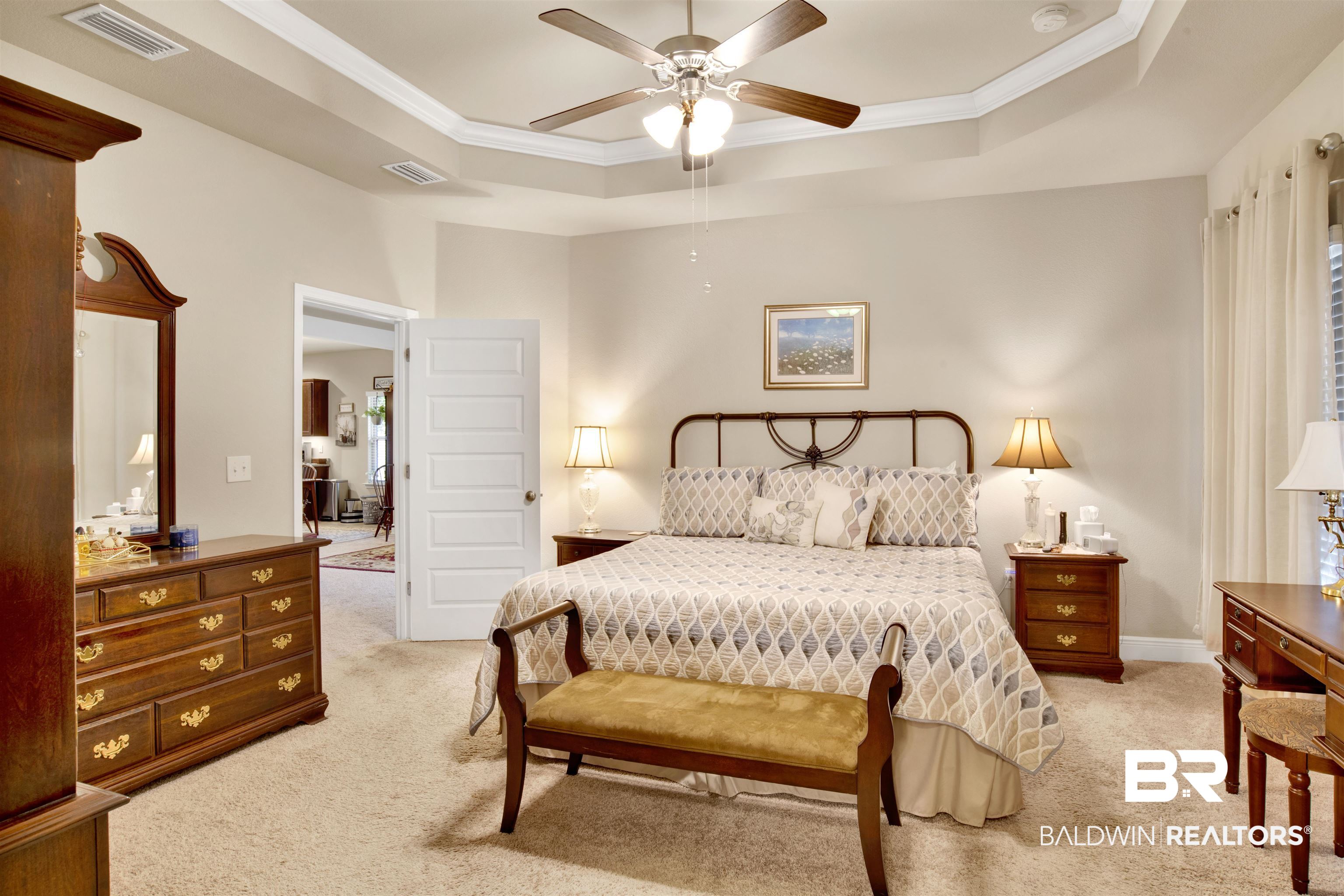 1476 Surrey Loop Foley, AL 36535 - Photo 20 of 31 Carpeted bedroom featuring a raised ceiling, ornamental molding, and ceiling fan