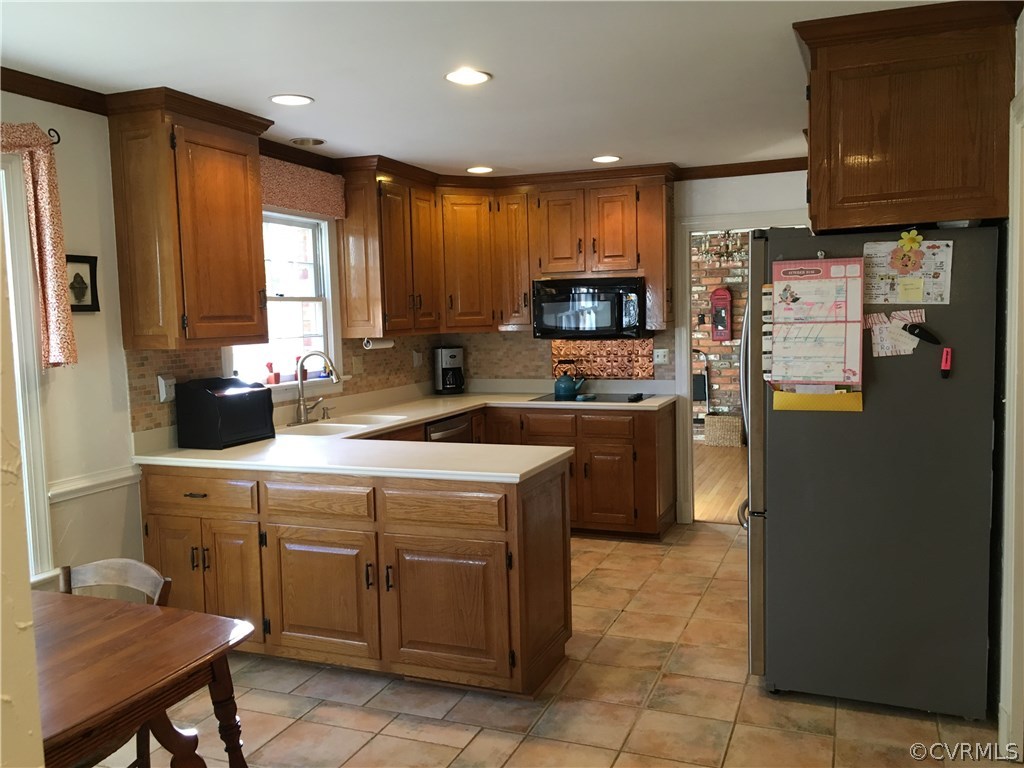 1900 Castlebridge Road Midlothian, VA 23113 - Photo 12 of 28 a kitchen with a sink a counter top space and appliances