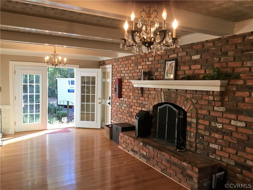 1900 Castlebridge Road Midlothian, VA 23113 - Photo 13 of 28 a view of a livingroom with a fireplace window and wooden floor