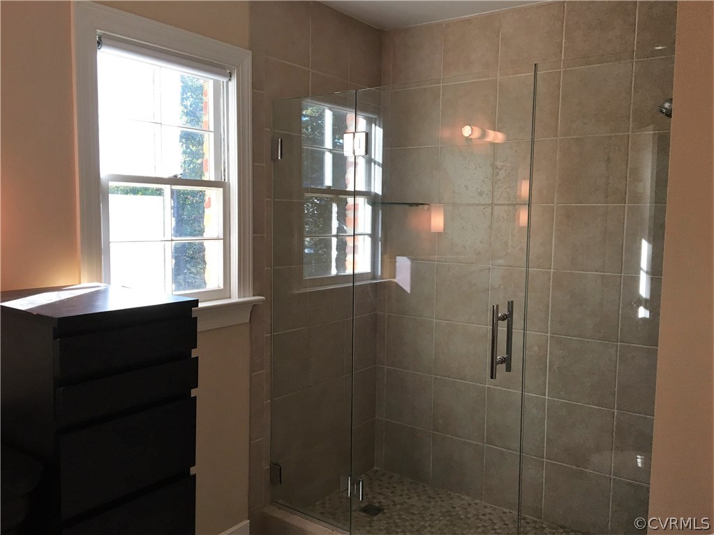 1900 Castlebridge Road Midlothian, VA 23113 - Photo 17 of 28 a bathroom with a window and a shower