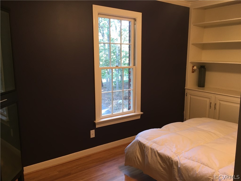 1900 Castlebridge Road Midlothian, VA 23113 - Photo 20 of 28 a bedroom with a bed and wooden floor