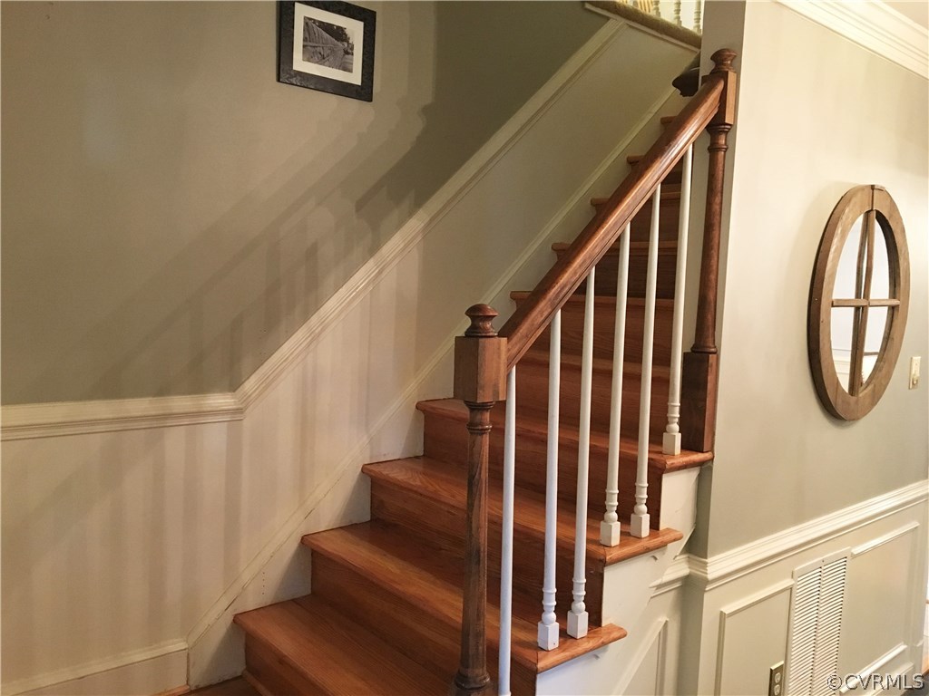 1900 Castlebridge Road Midlothian, VA 23113 - Photo 6 of 28 a view of staircase with lots of frames on wall and a window