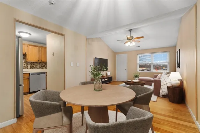 a view of a dining room with furniture and window