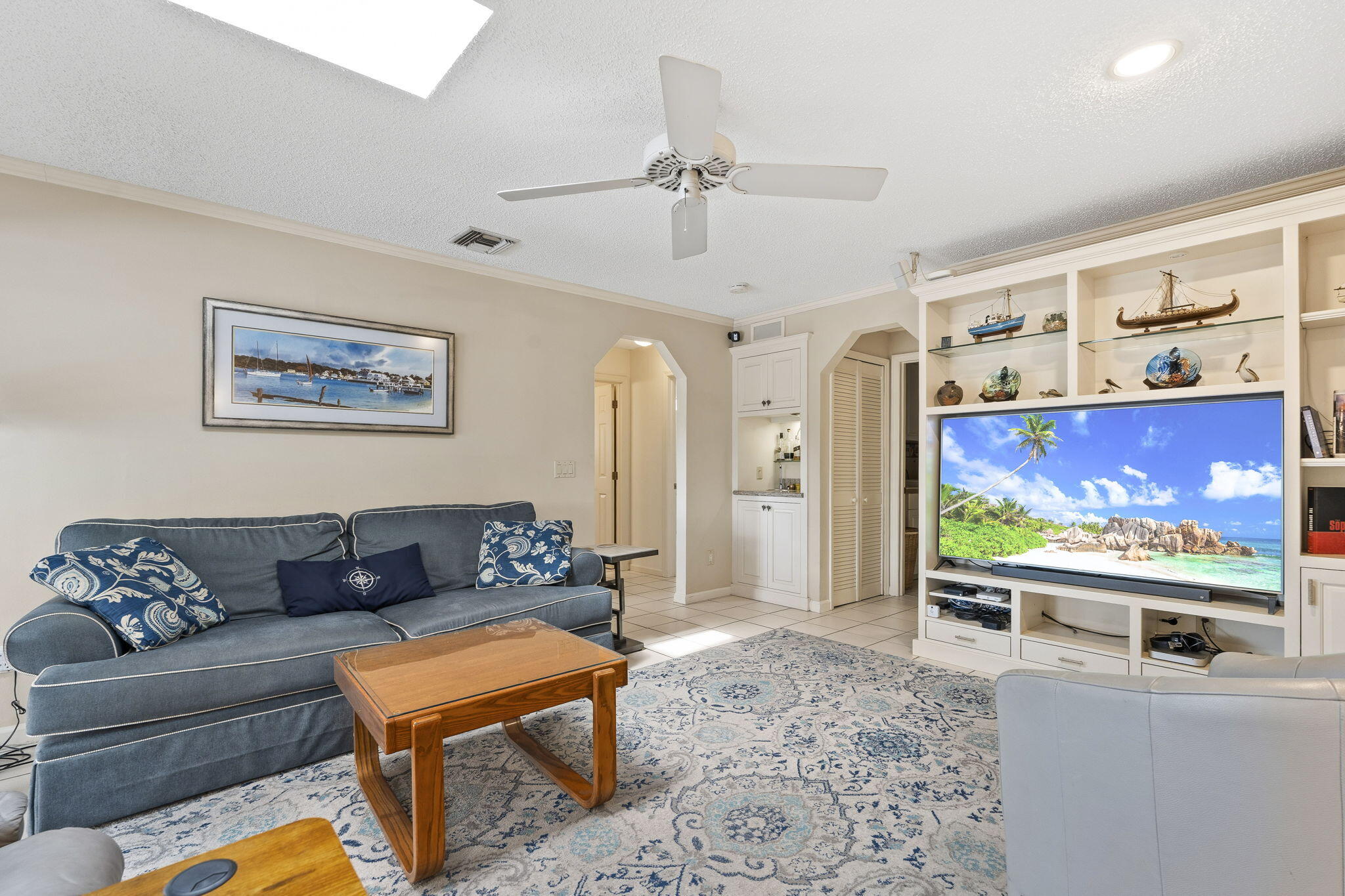 3374 Southeast Fairway East Stuart, FL 34997 - Photo 19 of 65 a living room with furniture and a flat screen tv