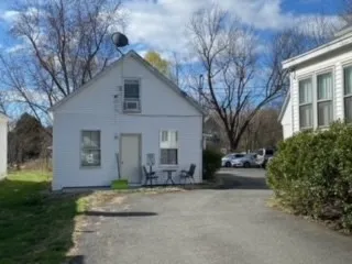 a front view of a house with garage and yard
