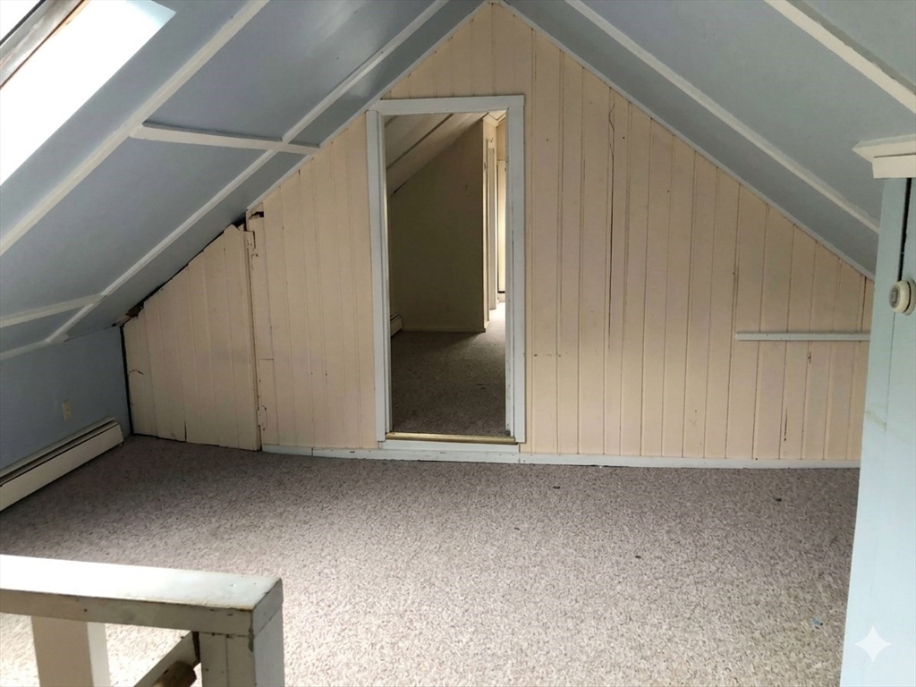 697 Main Street, Unit 3 Amherst, MA 01002 - Photo 4 of 10 a view of an empty room with wooden floor