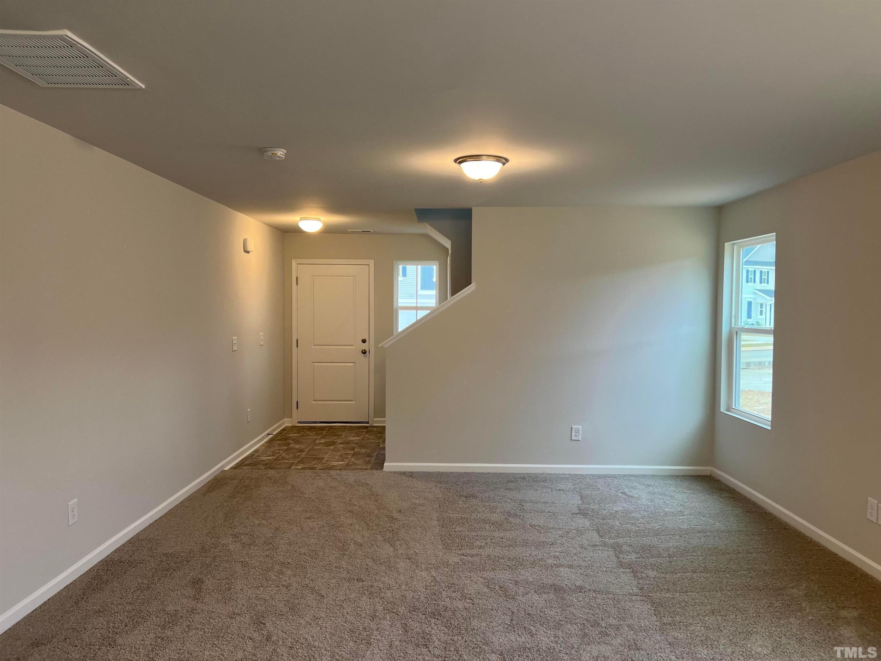 179 Maple Tree Lane Clayton, NC 27527 - Photo 4 of 18 a view of an empty room