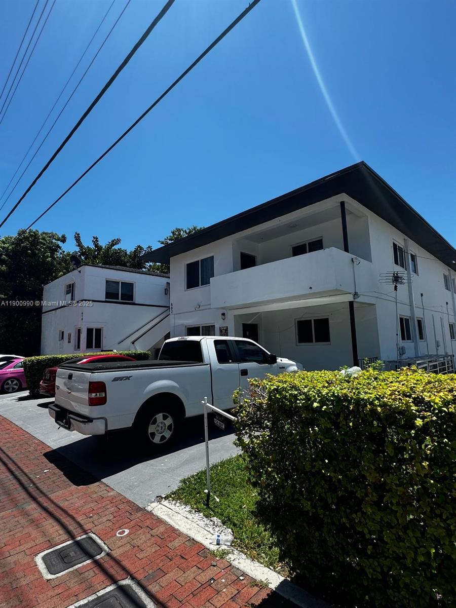 602 Southwest 13th Avenue, Unit 4 Miami, FL 33135 - Photo 1 of 13 a front view of a house with parking space