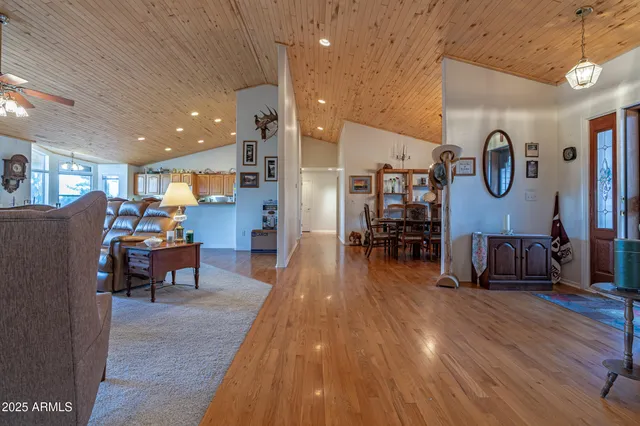 a view of a livingroom with furniture and windows