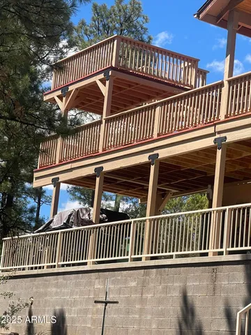 a front view of a house with yard and tree