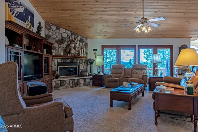 a view of a dining room with furniture wooden floor and chandelier
