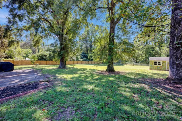a view of a garden with swimming pool