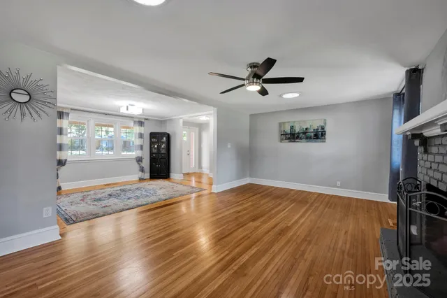a view of livingroom with hardwood floor and a ceiling fan